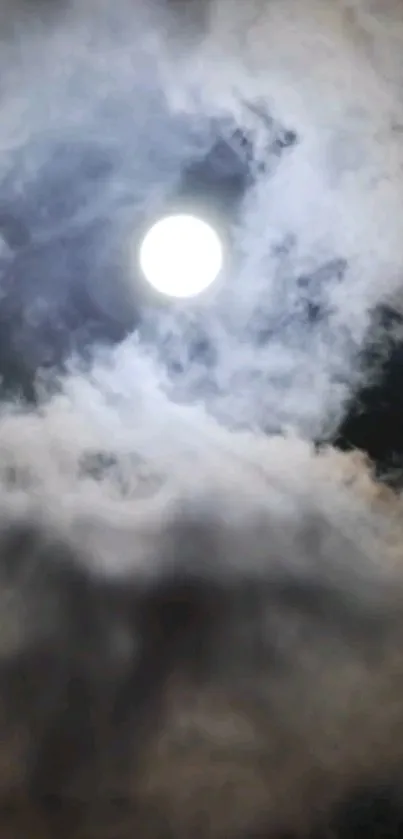 A bright moon shines through swirling clouds at night.