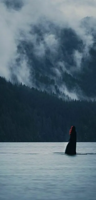 Mystic mountain lake with mist and trees.