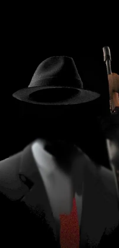 Mysterious noir figure with hat and suit on dark wallpaper.