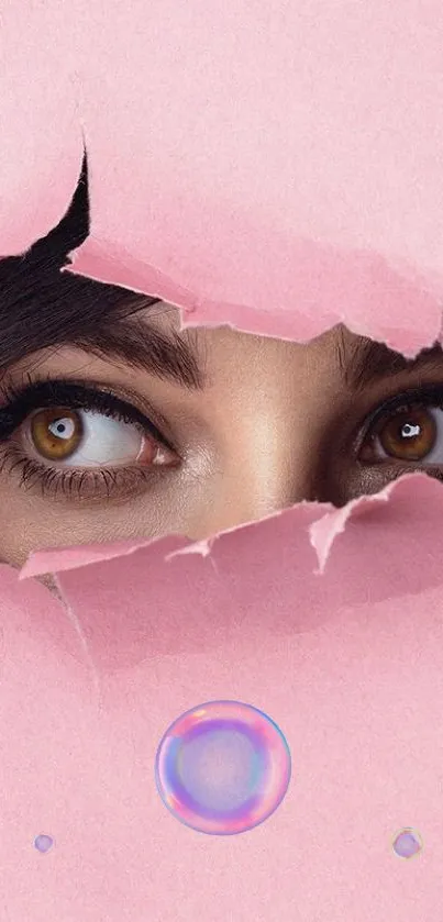 Mysterious eyes peeking through pink torn paper wallpaper.