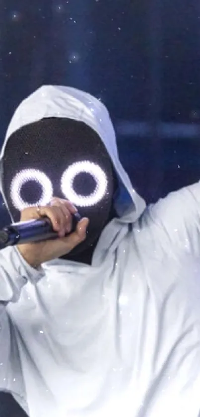 Mysterious performer in white hoodie with glowing eyes holding a microphone.