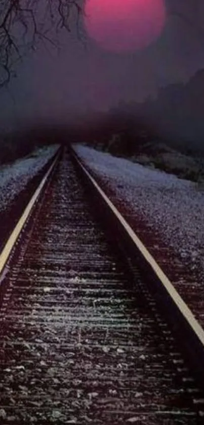 Eerie railway under a red moon night sky.