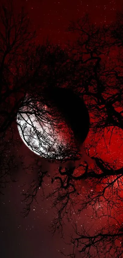 Dark red moon with silhouetted trees and starry sky.