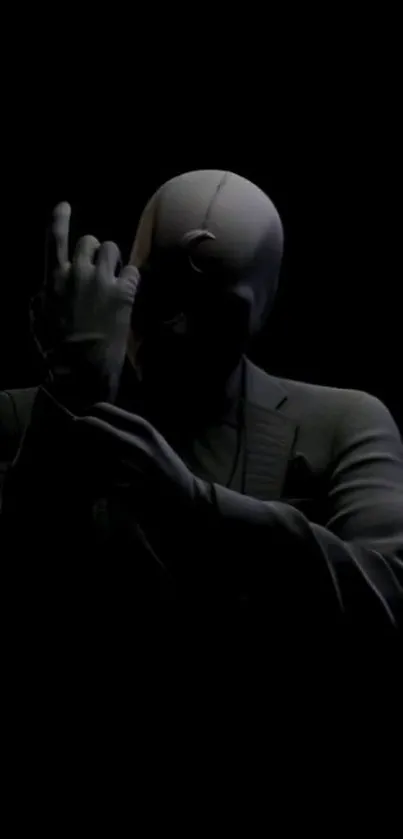 Mystery silhouette in dark suit with black background.