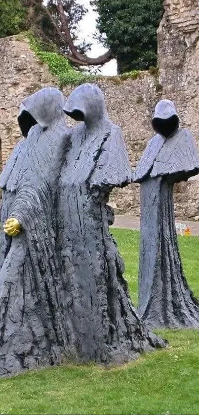 Hooded stone figures in a historic garden setting.