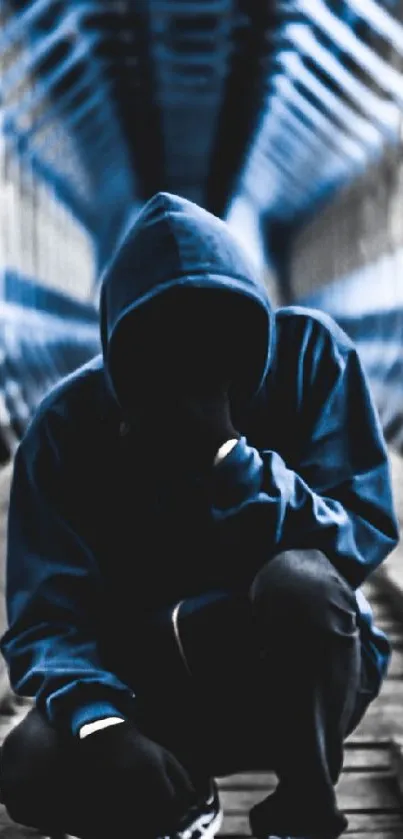 Hooded figure on a wooden bridge with blue architecture in the background.