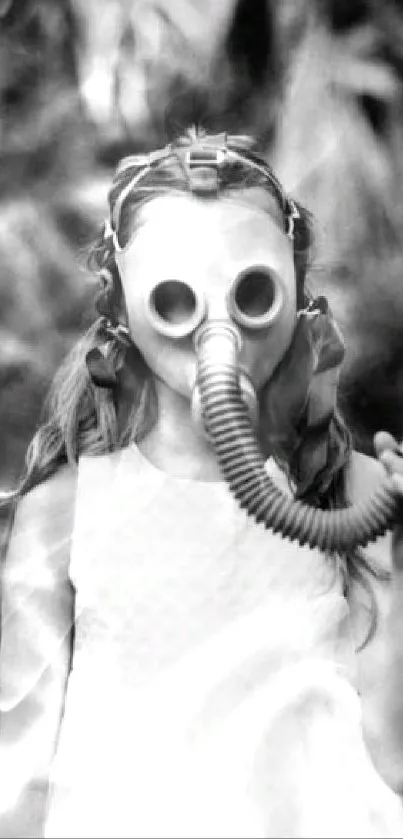 Black and white photo of child wearing a gas mask in a forest setting.