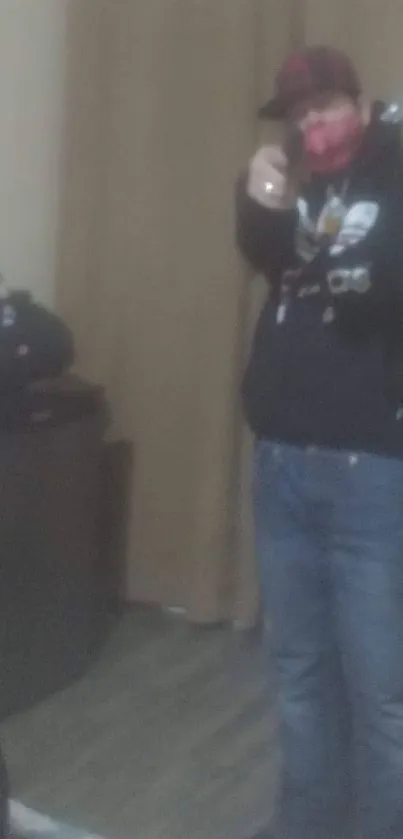 Blurred image of a person in casual attire creating a mysterious vibe.