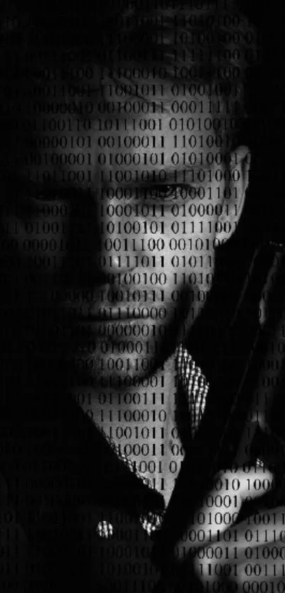 Monochrome wallpaper of mystery figure with binary code overlay.