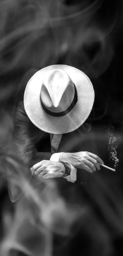 Mysterious man in fedora with black background.