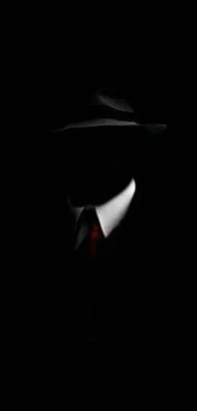 Mysterious silhouette of a suited figure in darkness.