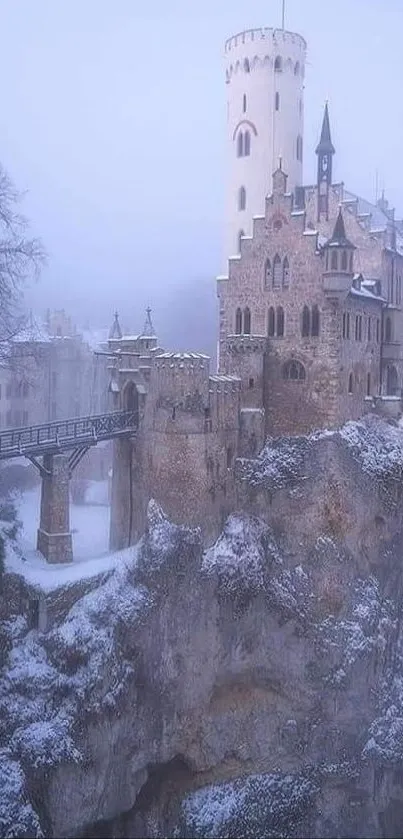 Snowy medieval castle amidst a mystical winter mist on a cliff.