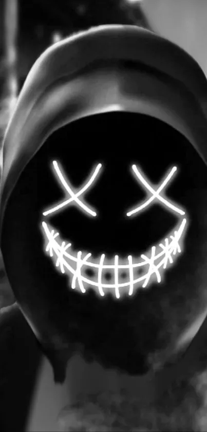 Dark hooded figure with glowing neon face in black and white aesthetic.