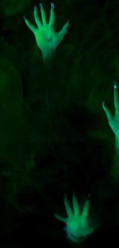 Dark green wallpaper with glowing hands reaching out.