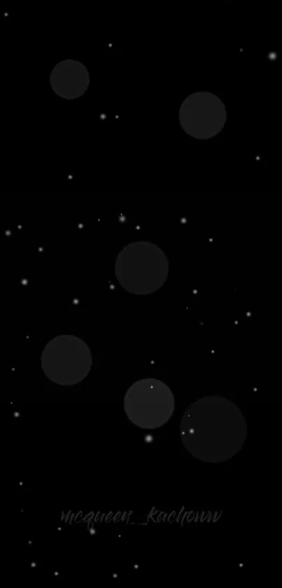 Minimalist black wallpaper with stars and glowing circles.