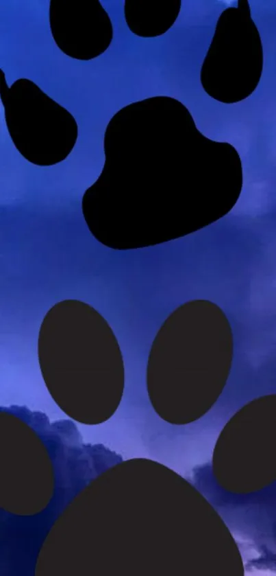 Sky wallpaper with black paw prints on blue and purple cloud background.