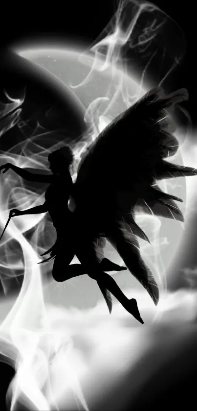 Mystical angel silhouette against smoky, ethereal background.