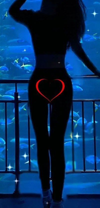 Silhouette in front of a mystical blue aquarium background with a heart detail.