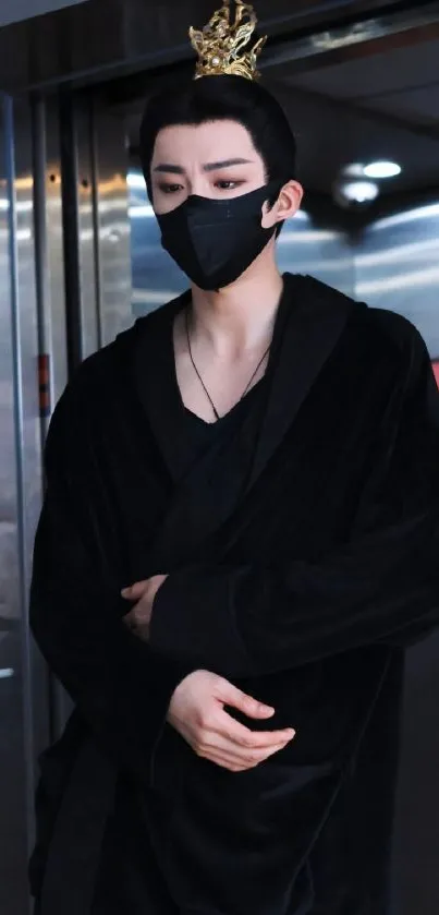 Elegant figure in black attire and mask in an elevator.