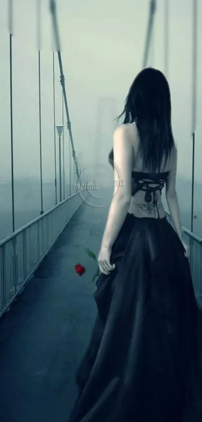 Woman in black dress on foggy bridge, holding a red rose.