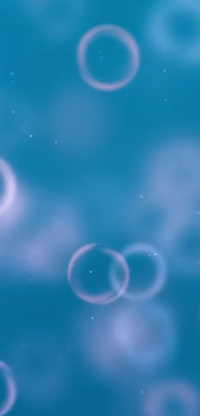 Dreamy blue wallpaper with floating bubbles.