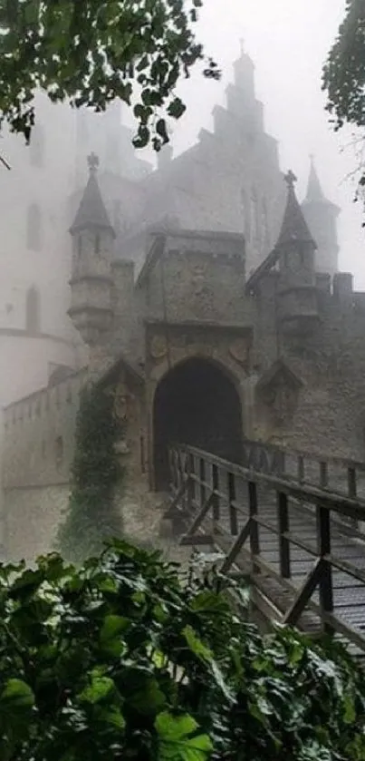 Misty view of a historic castle surrounded by fog and greenery.