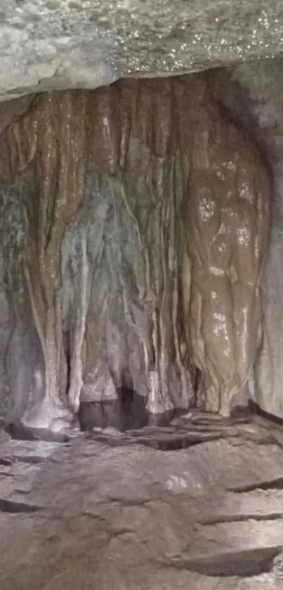 Brown cave formations with stalactites and shadows.