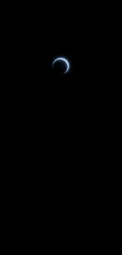 Mystical crescent eclipse in black sky.