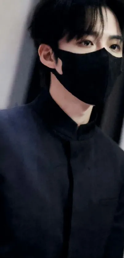 Portrait of an individual wearing a black mask with an elegant background.