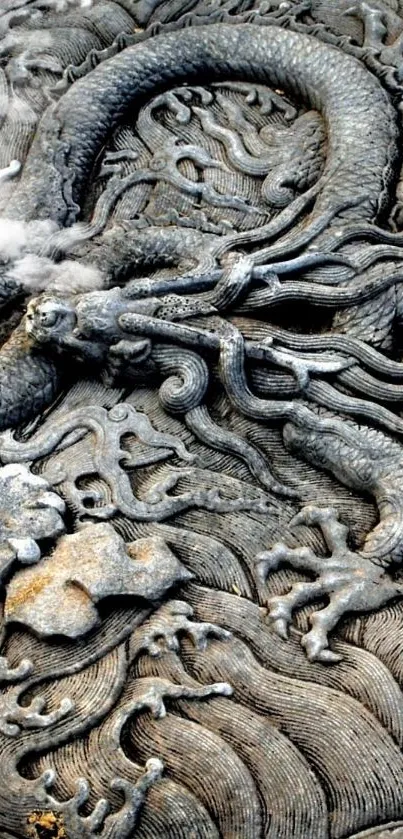 Intricate stone carving of a dragon with a mystical aura, perfect for wallpapers.