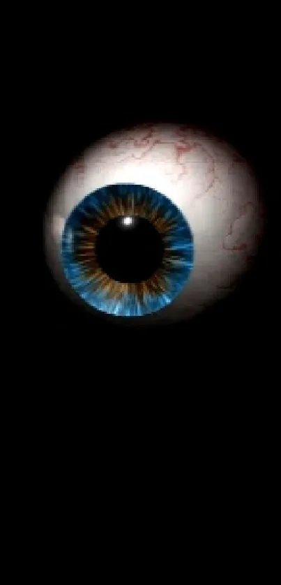 A mystical blue eye on dark background wallpaper.