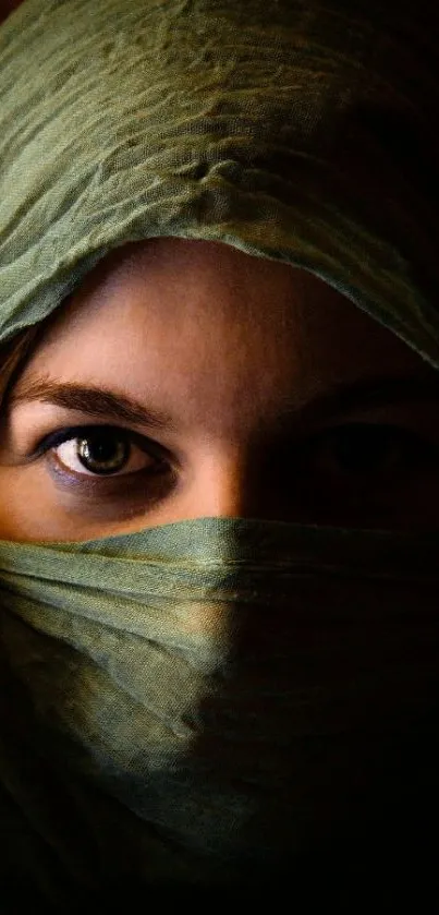 Mysterious eyes peeking from olive green veil.