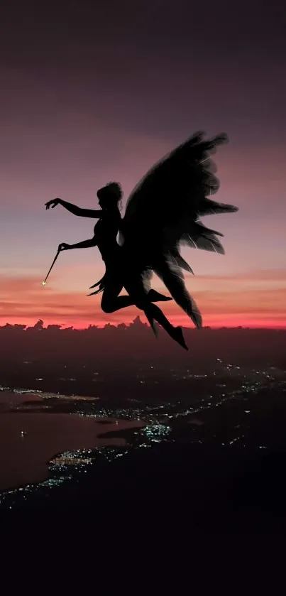 Silhouette of a fairy against a vibrant sunset over a cityscape.