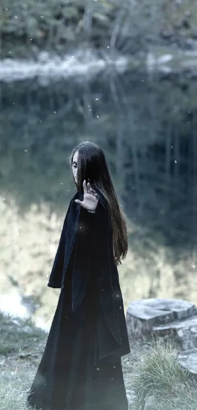 Mystical figure in black by a serene forest lake.