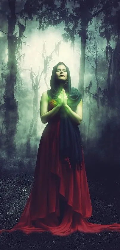 Mystical woman in red dress with green glow in enchanted forest wallpaper.