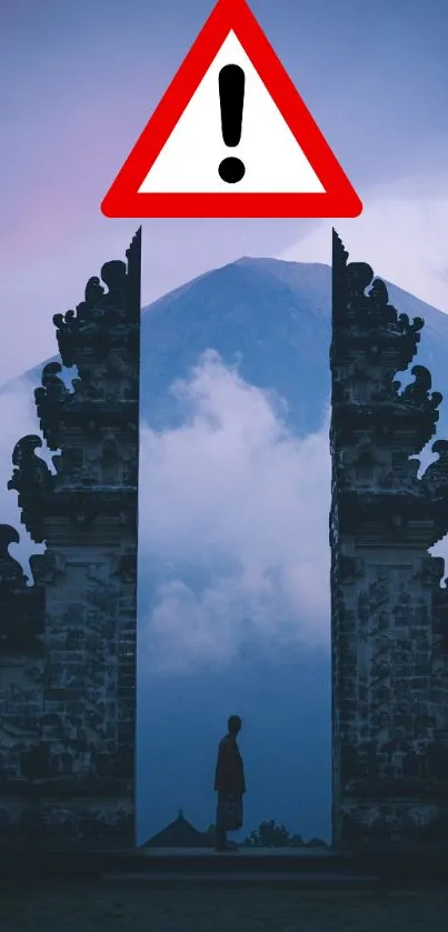 A mystical gate frames a mountain under a purple sky.