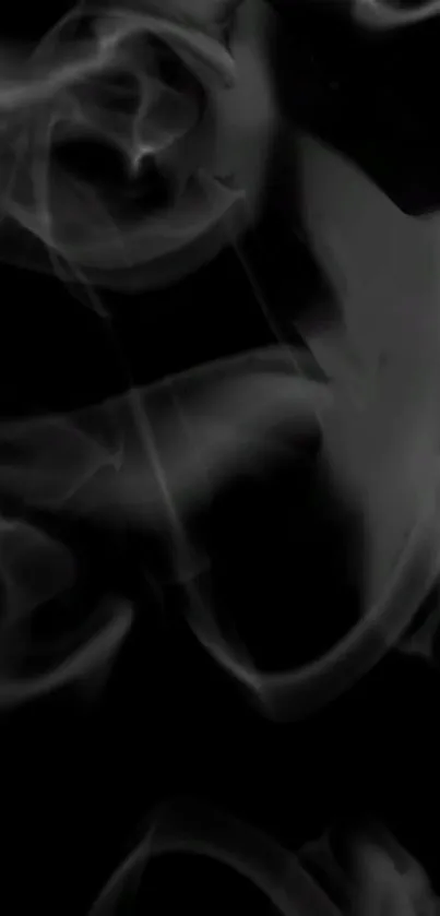 Mystical gray smoke swirling abstract wallpaper.