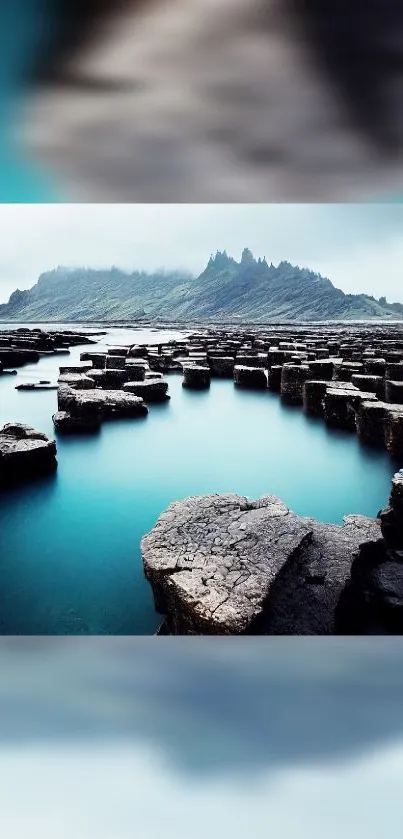 Hexagon rock formation with turquoise sea and misty hills.