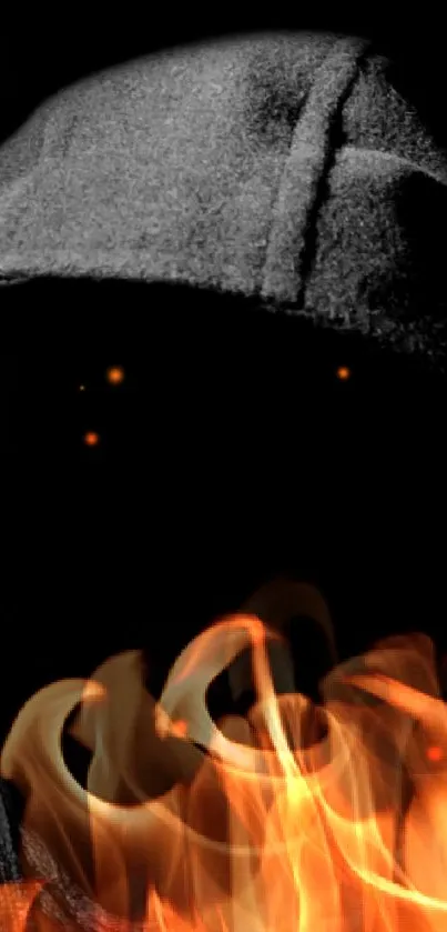 Hooded figure with flames in a dark themed mobile wallpaper.