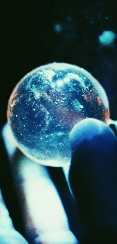 A mystical glowing sphere held in a hand against a dark background.