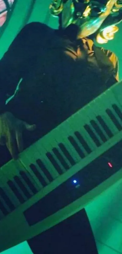 Masked musician playing keyboard with green lighting, artistic wallpaper.