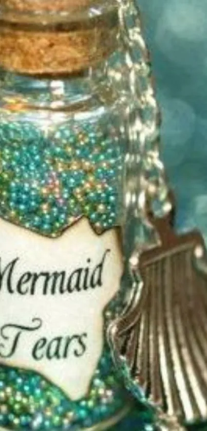 Close-up of a mystical 'Mermaid Tears' bottle with teal beads and a seashell pendant.