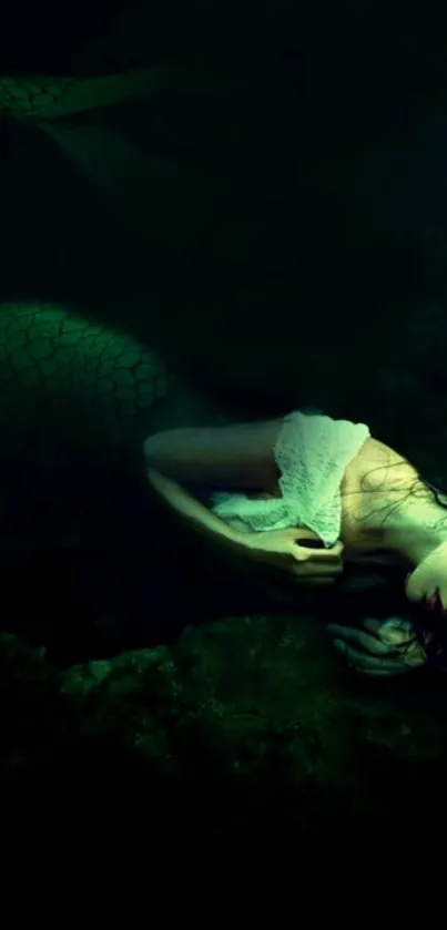 Mystical mermaid resting underwater in a dark, ethereal scene.