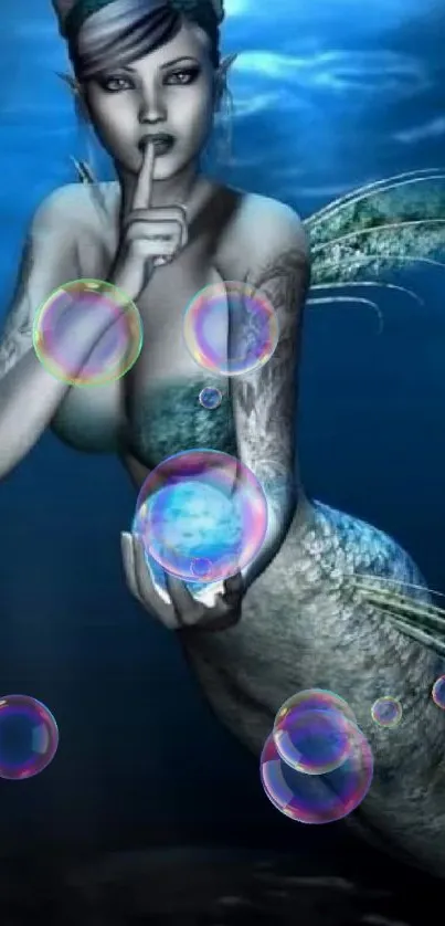 Mystical mermaid holding orb underwater in dark ocean.