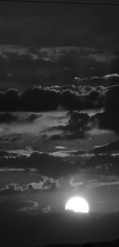 Monochrome sunset with dramatic clouds and serene sky.