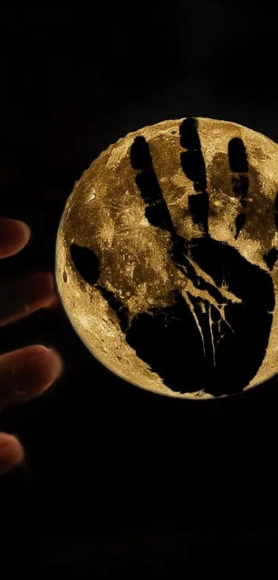 A hand shadow cast on a glowing moon, creating a mysterious and mystical wallpaper.