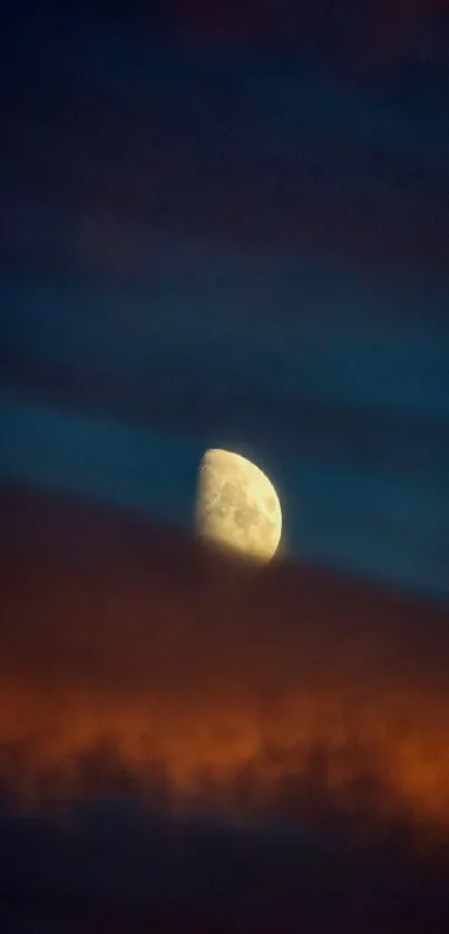 Half-moon in vibrant orange and blue clouds.