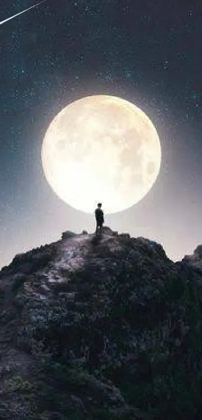 Silhouette on mountain peak under full moonlight and starry night sky.