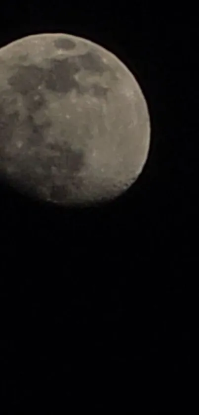 A mystical moonlit wallpaper showcasing a bright lunar surface against a dark sky.