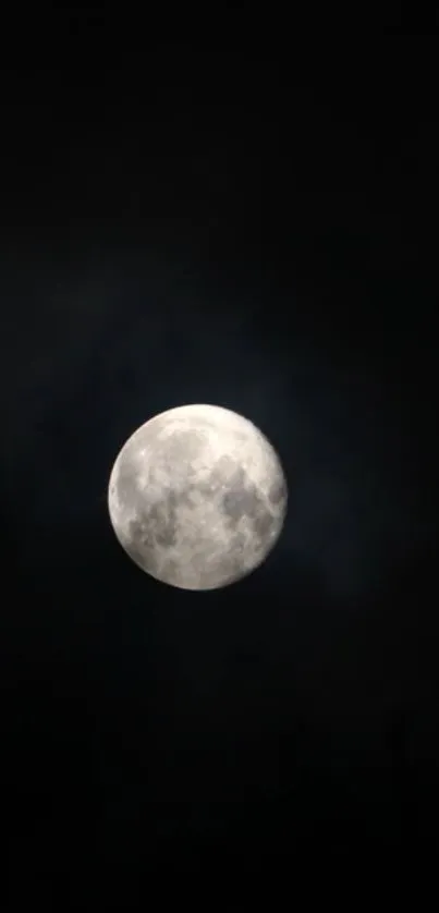 Full moon glowing in a dark night sky, creating a mystical effect.